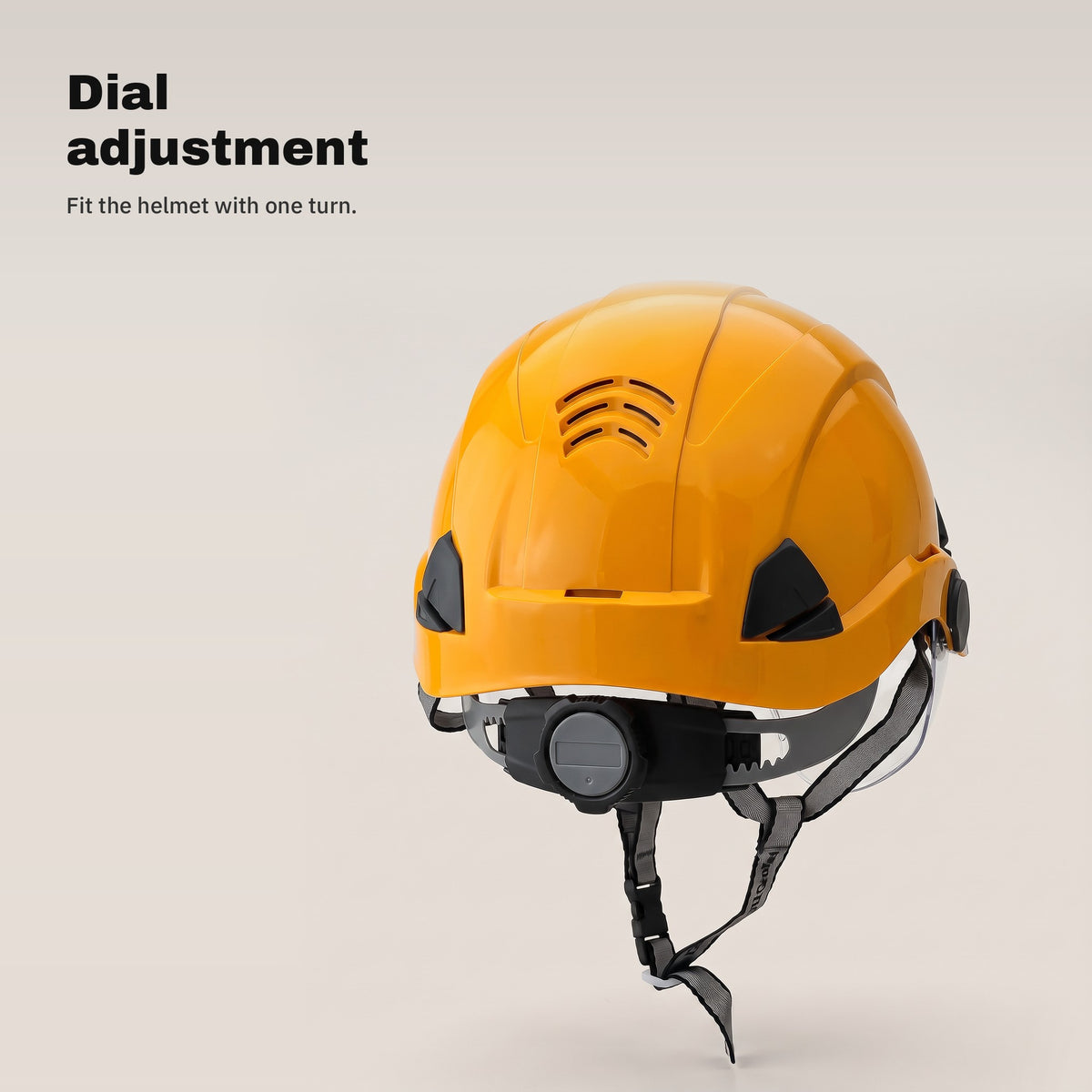 Adjustment dial at the back of the orange safety helmet