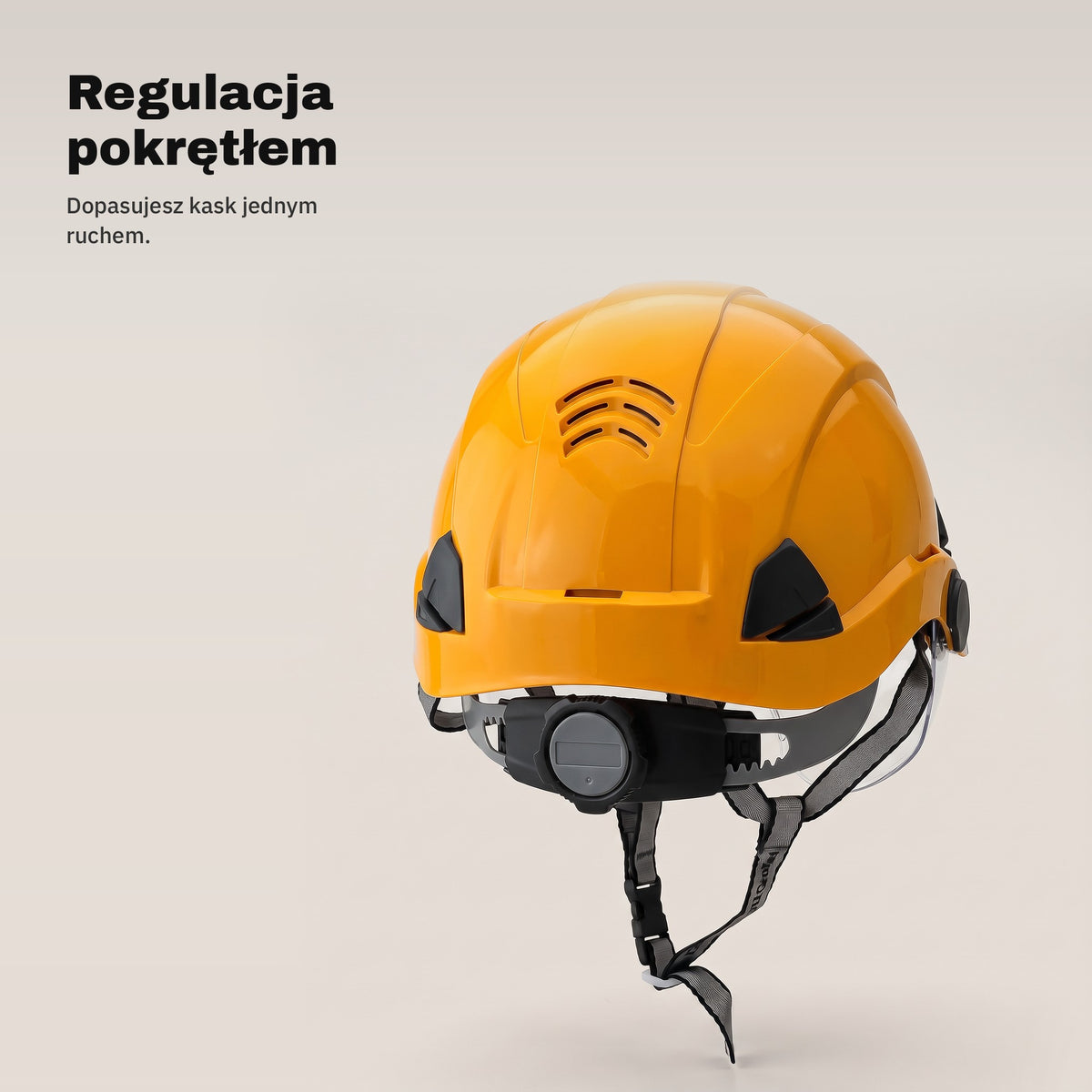 Pokrętło regulacji z tyłu pomarańczowego kasku ochronnego