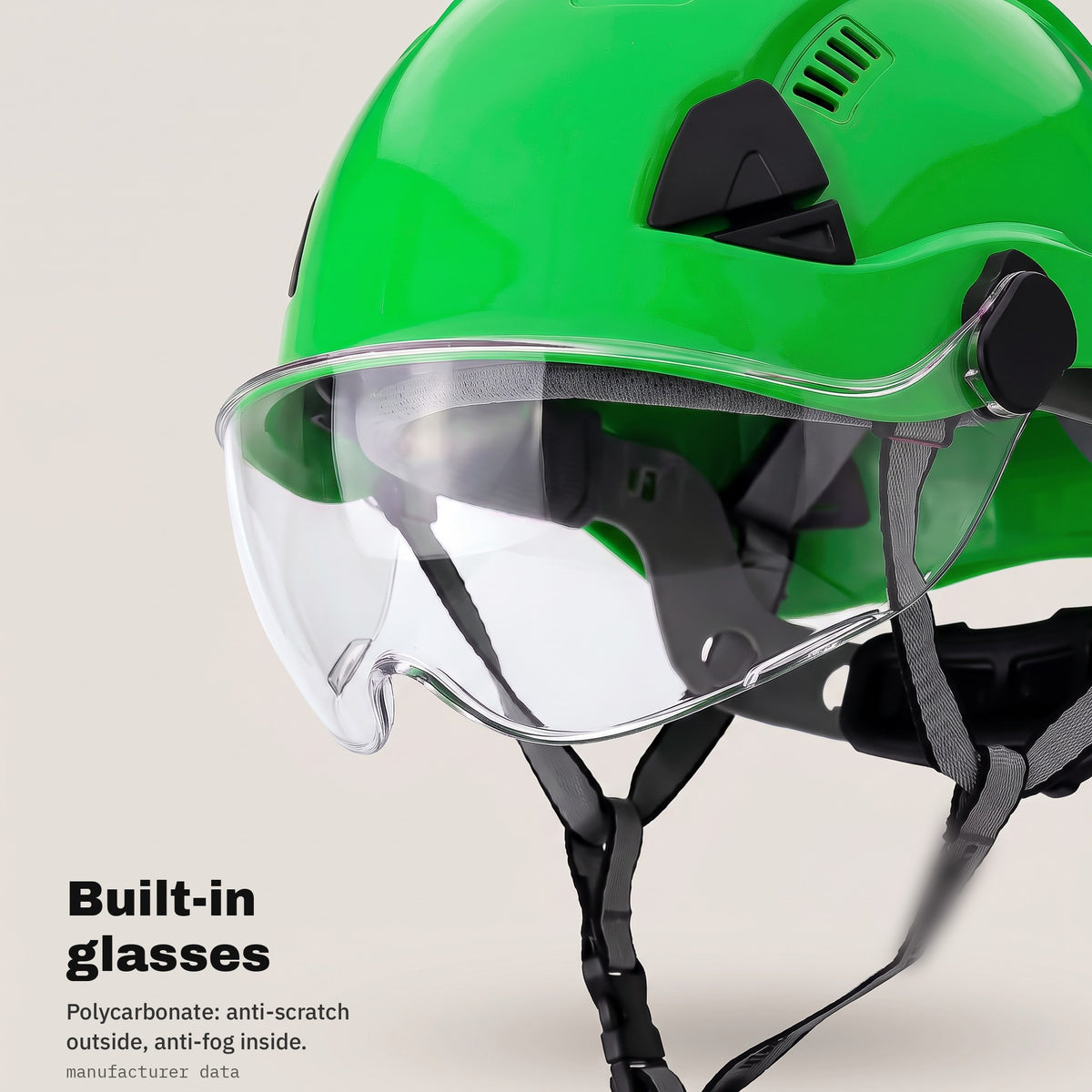 Built-in polycarbonate glasses in the green safety helmet