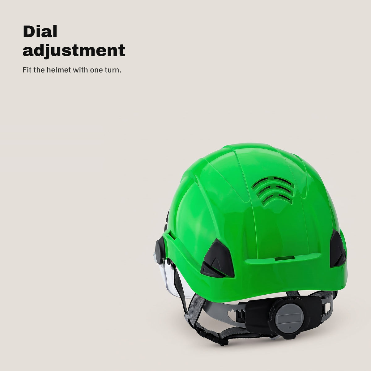 Adjustment dial at the back of the green safety helmet