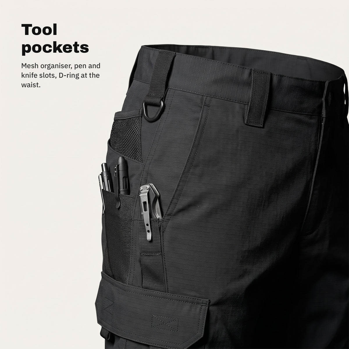 Tool pockets with organiser and D-ring at the waist of the cargo trousers